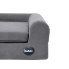 Close-up of a grey orthopedic memory foam pet bed with a plush bolster and the Buddie brand logo